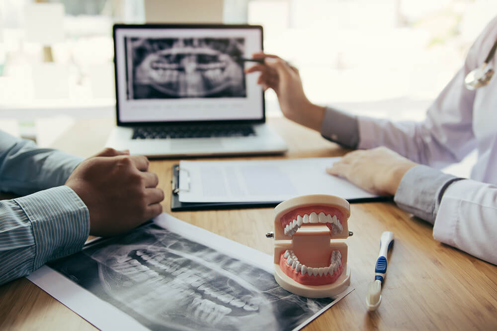 patient speaking with a dentist